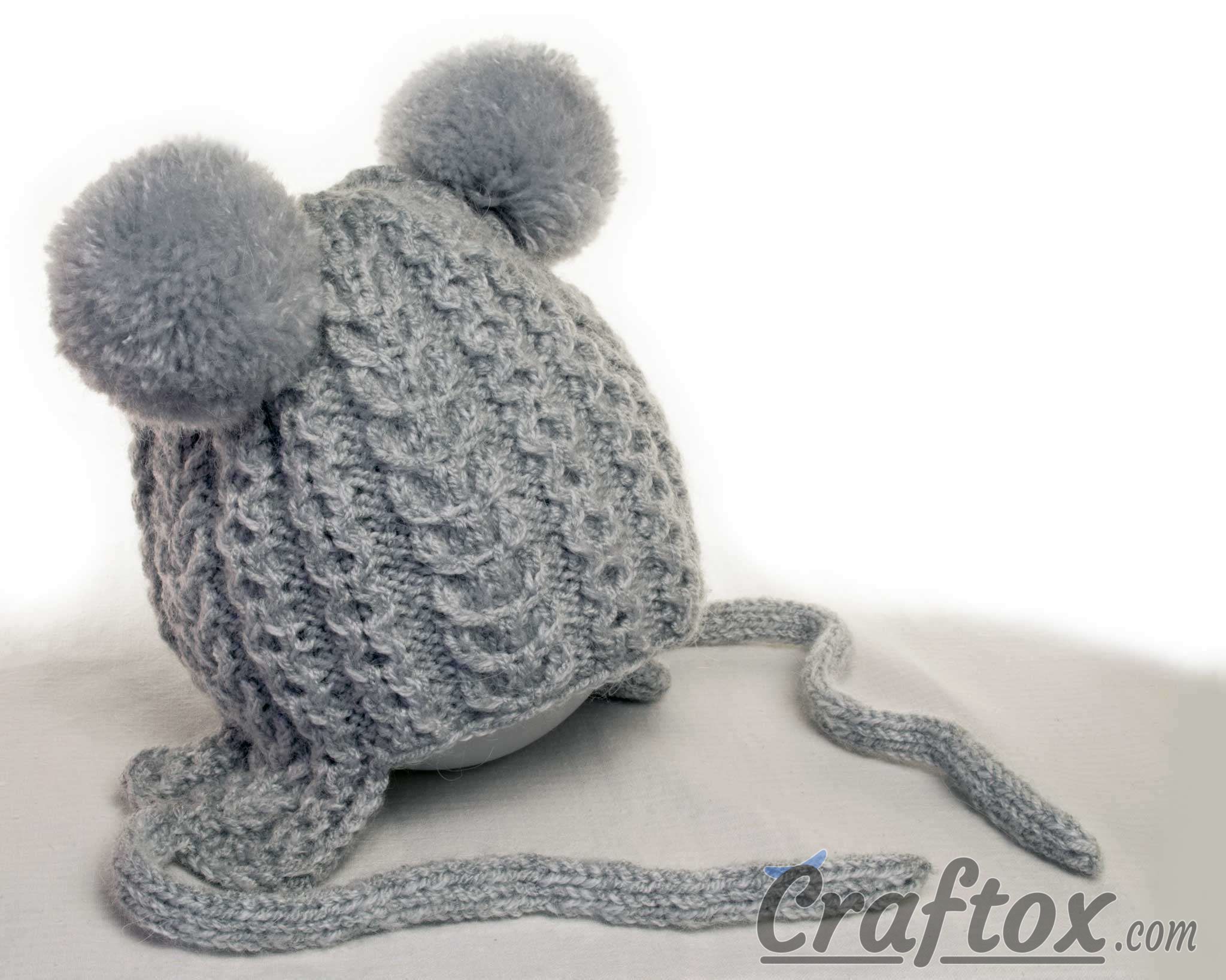 Knitting winter hat with pom poms for kid. Free pattern